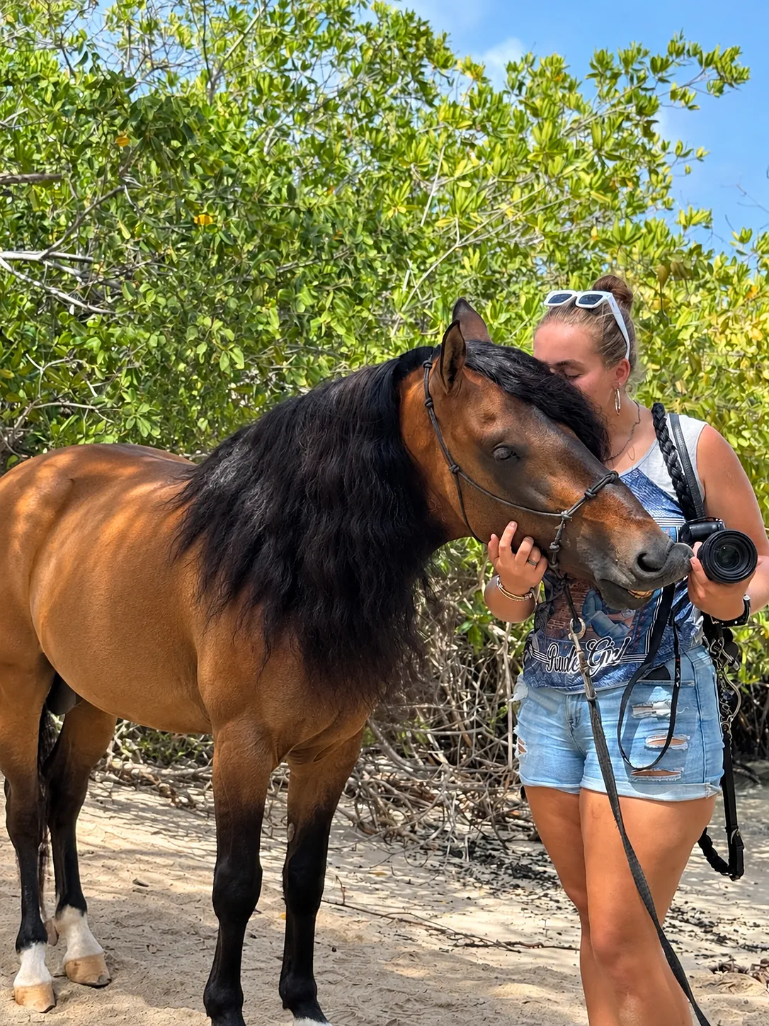 Marjolein cuddling Hennessy in the mangroves on Aruba